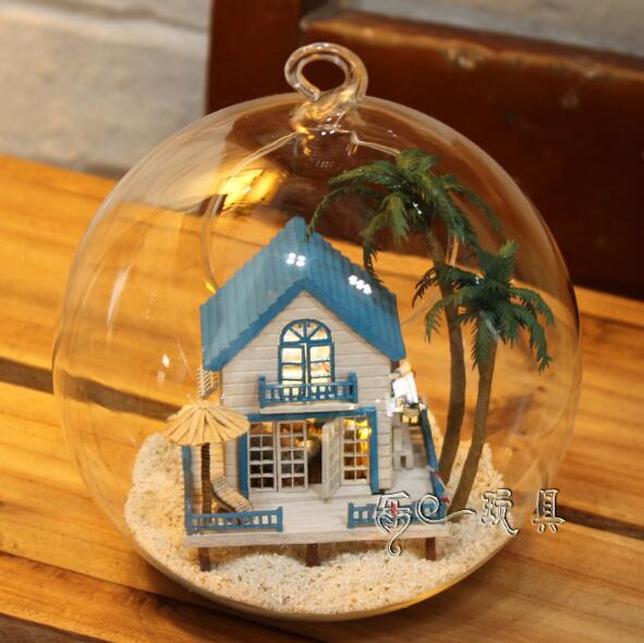 Wooden Doll Houses In Glass Ball
